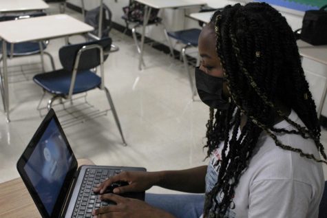Cayla Johnson signs on to her computer to start work. She enjoyed her online learning experience and would consider doing it again in the future.