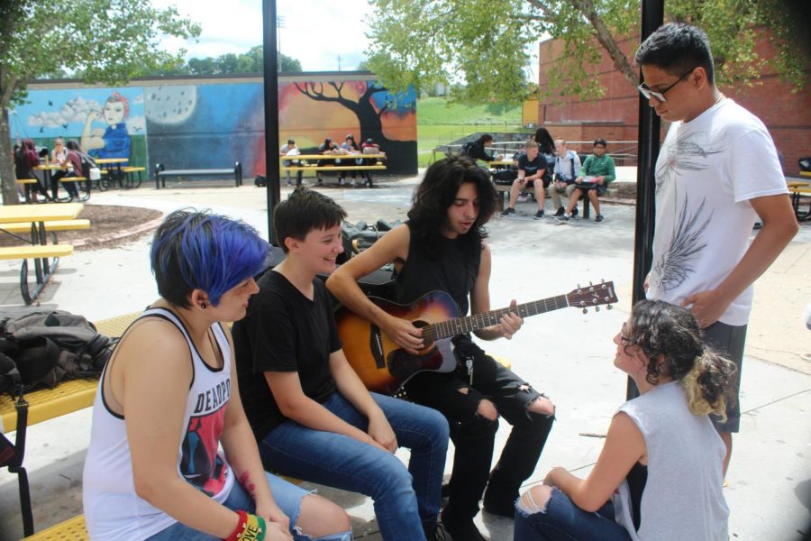 Turner, Thunderrock, and Ducros sing along and play outside in the courtyard. Their first appearance with their instruments in the lunchroom was in mid-August.