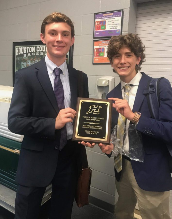 Juniors Patrick McKenzie and Andrew Doerr show off their plaque at the Bruce Rogers tournament at Houston County high school on September 8, 2018. McKenzie and Doerr have been on the debate team for three years.