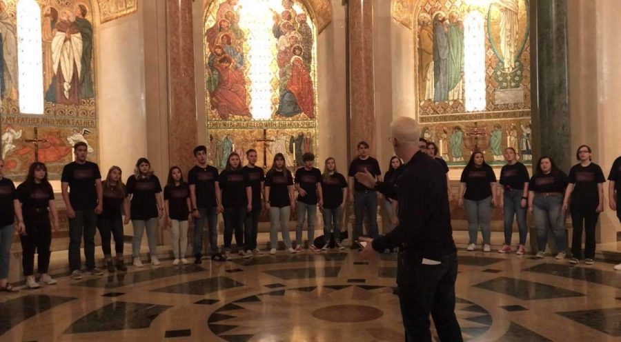 Mr. Josh Markham conducts the chorus in the Basilica of the National Shrine of the Immaculate Conception. The Basilica is 60 years old this year.