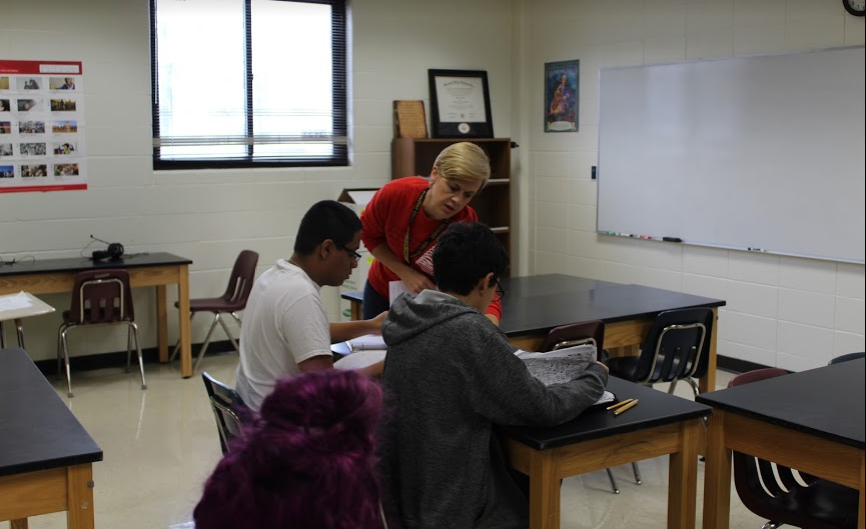 Ms. Tiffany Weck reviews with biology students before a test over cell reproduction on a Monday morning. Weck’s willingness to help students was cited by a colleague as a source of inspiration.  Photo by Emily Hill