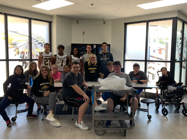 Top row (left to right)- Landon Miller, Jaden Mitchell, Dion Rolle, Caleb Torrance, Nolan Pollard 

Middle Row (left to right) Alesia Johnson, Will Carnes, Jada Tyson, Andrew Fulcher and John Rothenburger 

Bottom Row (left to right)- Breana Ortiz, Martha Isley, Patrick Chase, George Rueve, Bryce Hall 

Ice cream givers Isley, Rolle, Torrance, and Packard pose for a picture with special needs students. These students helped make the ice cream treat possible for fourth period lunch. photo provided by Chuck Childress