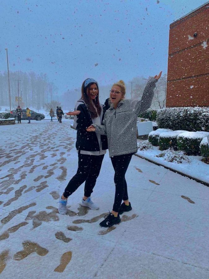 Lidia Herrera and Mary Ohlrich enjoy the snow outside of Sequoyah. The Feb. 8 ACT was canceled mid-test due to inclement weather conditions. 