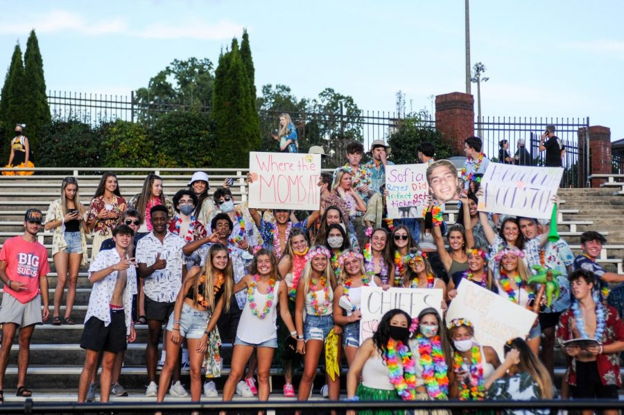 The student section cheer on the football team from the stands. This year, potentially dangerous items were restricted from the student section.